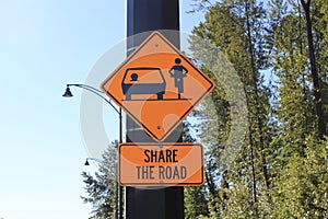 Share the road sign for motorists and bikes