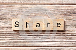 Share word written on wood block. share text on table, concept