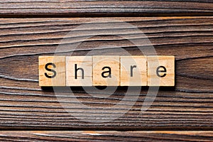 Share word written on wood block. share text on table, concept