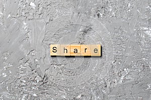 Share word written on wood block. share text on table, concept