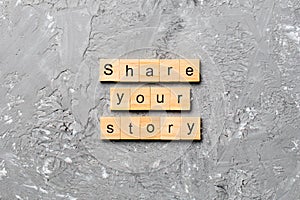 Share you story word written on wood block. share you story text on table, concept