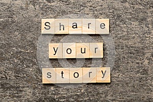 share you story word written on wood block. share you story text on table, concept