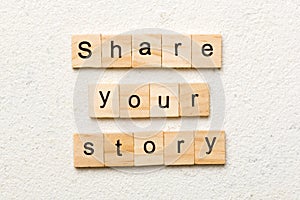 share you story word written on wood block. share you story text on table, concept