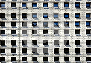 Sharing accommodation in crowded space shows a modern difficult cohabitation or coexistence. Pattern of little adjacent windows photo