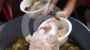 Sharing food on Kirab ketupat. Kirab ketupat is a celebration of Eid al-Fitr by distributing free food