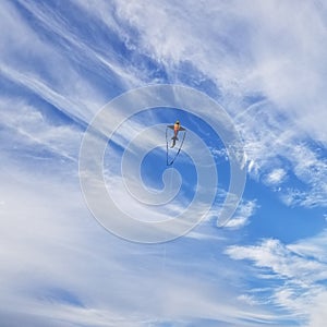 A shark kite flying high in the sky