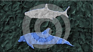 Shark vs dolphin made of clay in stop motion