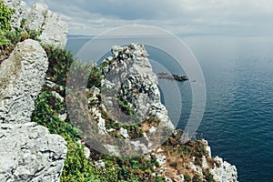Sharp cliffs hang over the ocean, Dramatic marine background