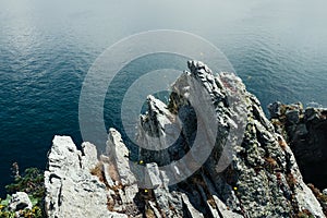 Sharp cliffs hang over the ocean, Dramatic marine background