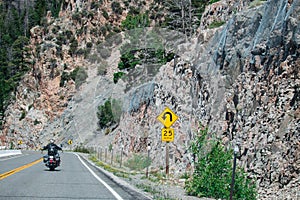 Sharp Curve Road and Sharp Curve Warning Sign.