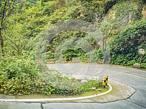 Sharp curve view on the bus on tongtian road moving from tianmen mountain heaven gate cave photo