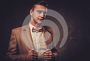 Sharp dressed man wearing jacket and bow tie