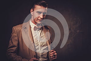 Sharp dressed man wearing jacket and bow tie