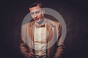 Sharp dressed man wearing jacket and bow tie