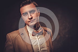 Sharp dressed man wearing jacket and bow tie