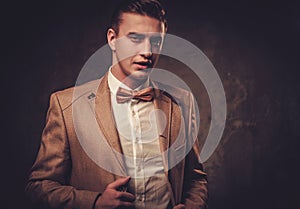 Sharp dressed man wearing jacket and bow tie