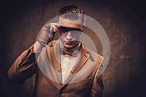 Sharp dressed man wearing jacket and bow tie