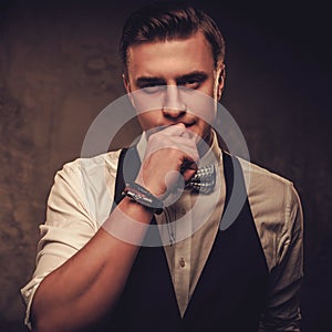 Sharp dressed man wearing waistcoat and bow tie