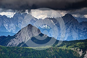 Sharp edged peaks under threatening dark clouds in Carnic Alps