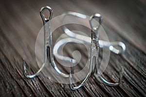 Sharp fish hooks photographed close-up. Sharpened hook will not give a chance to fish to escape from the fisherman.
