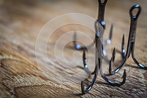 Sharp fish hooks photographed close-up. Sharpened hook will not give a chance to fish to escape from the fisherman.