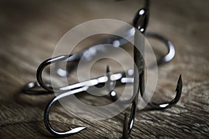 Sharp fish hooks photographed close-up. Sharpened hook will not give a chance to fish to escape from the fisherman.