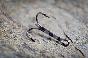 Sharp fish hooks photographed close-up. Sharpened hook will not give a chance to fish to escape from the fisherman.