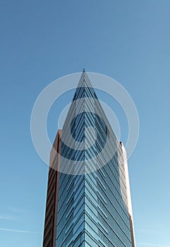 Sharp geometric glass facade from building at Potsdamer Platz Berlin Germany