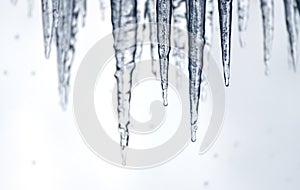 Sharp icicles dripping with water behind Niagara Falls