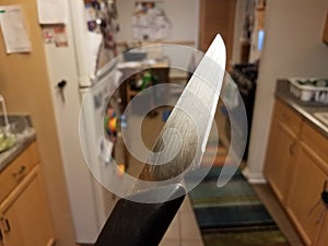 Sharp metal knife in kitchen first person perspective