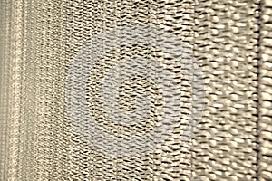 Sharp metallic texture. Silver foil background. Metal surface lathing. Metallic netting. Protective material. Metal
