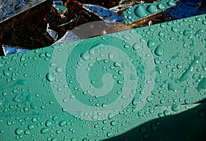 Sharp mirror waste with waterdrops waiting the transport back to the glass factory