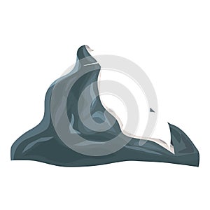 Sharp mountain peak reaching high above clouds