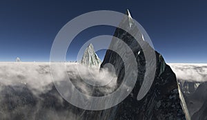 Sharp peak surrounded by low hanging clouds and a second peak in the back