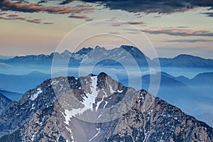 Sharp ridges of Karavanke and Kamnik Savinja Alps at hazy dusk