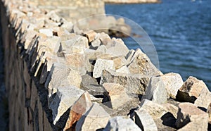 Sharp Rock Retaining Wall Beside the Ocean