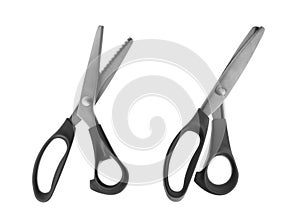 Sharp sewing scissors on white background