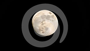 Sharp telescope capture of glowing full moon isolated on black outer space