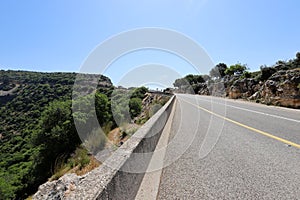 Sharp turn and climb and descent on a mountain road