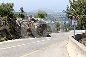 Sharp turn and climb and descent on a mountain road