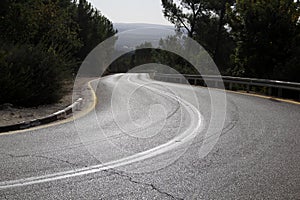 Sharp turn and climb and descent on a mountain road