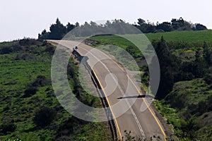 Sharp turn and climb and descent on a mountain road