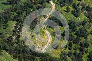 Sharp turn and climb and descent on a mountain road