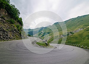 Sharp turn on mountain road, serpentine on the georgian military road