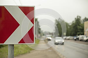 Sharp turn sign on road. Place of sharp bend in road