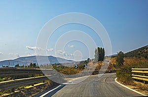 Sharp turn signs on a mountain road
