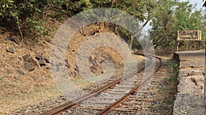 Sharp turns on narrow gauge rail network. Railway track laid down in the dense forest of India.