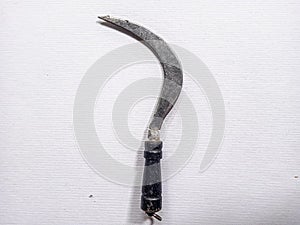 the sharp weapon typical of regional tribes in Indonesia is usually called sickle photo