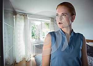 Sharp woman thinking by window