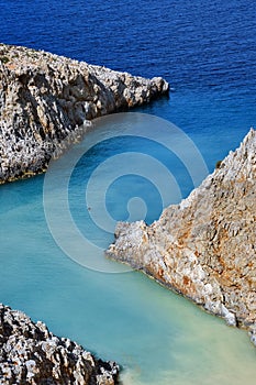 Sharp Z-shaped bay, cliffs, sea shores, crystal azure water. Natural geometry. Close shot. Seitan Limania, Akrotiri